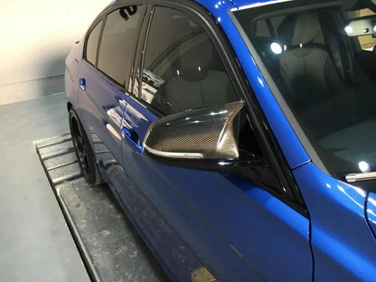F30 F32 F22 F87 Carbon Fiber M Style Mirror Caps passenger side on blue f30